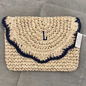 Brand new Scalloped straw monogramed w an “L” clutch
